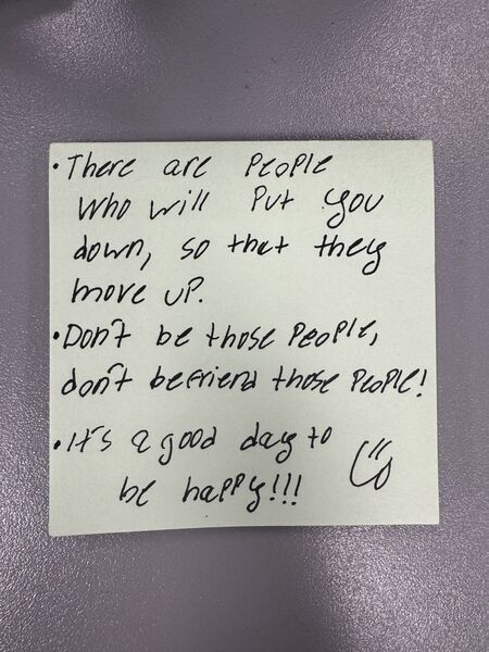 Handwritten sticky note with words of encouragement